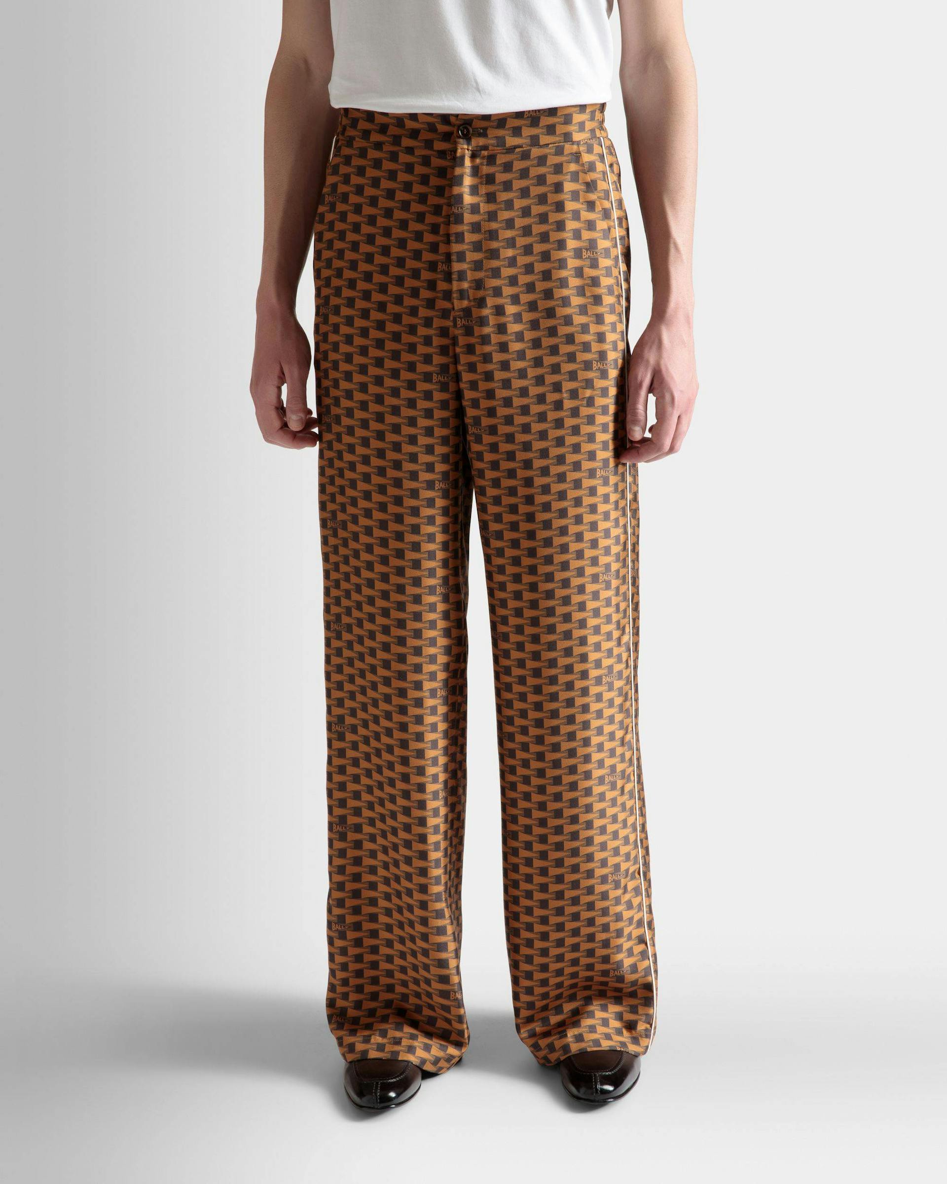 Men's Pennant Print Pants In Brown Silk | Bally | On Model Close Up